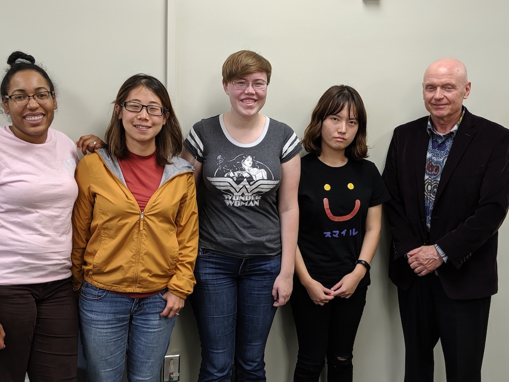  Dr. Frank Lawrence and students posing for photo